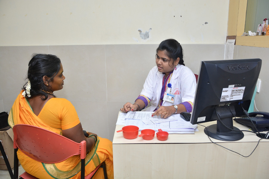 Photograph of a study participant discussing nutrition with a researcher