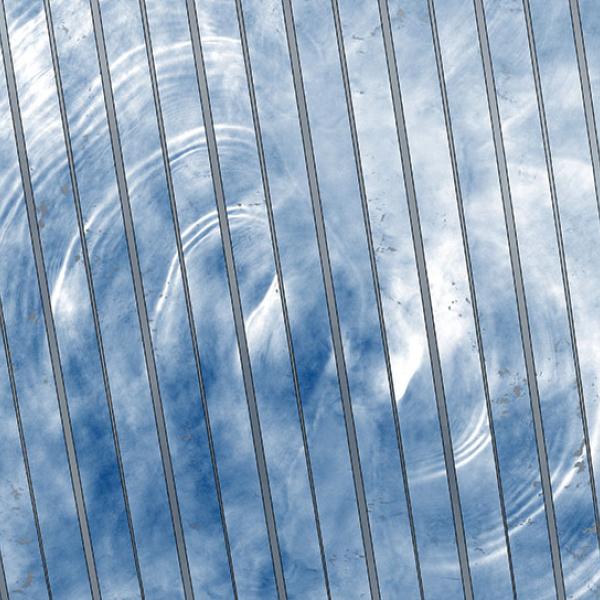 This visualization is a series of images in strips assembled together to make a larger, composite image. Each strip is colored in shades of white and blue to show waves of different heights on the water.