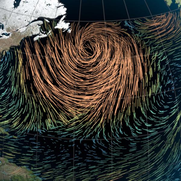 This North-at-the-top map shows portions of North and South America on the left side, the Atlantic Ocean in the middle, and Europe and Africa on the right. Over the North Atlantic is a swirl of wind represented by colored lines. The lines range from blue, green, and orange to show increasing speed. The lines are blue and green in the outer area of the swirl, and orange toward its center. 