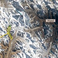 Aerial view of the Mt. Everest area from the International Space Station (ISS). The yellow highlighted region shows the Karma Valley where hikers were rescued from during the snowstorm, with the green marker indicating the approximate location and proximity of the Tibetan Mt. Everest Base Camp