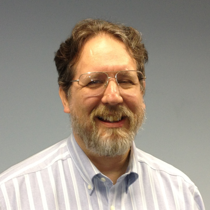 headshot of fred hurmmrich in front of a gray screen