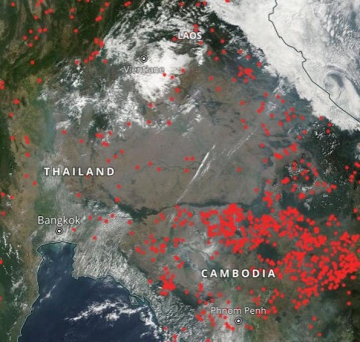 This screen capture from NASA Worldview shows the locations of widespread thermal anomalies and smoke haze in Thailand and neighboring Cambodia.