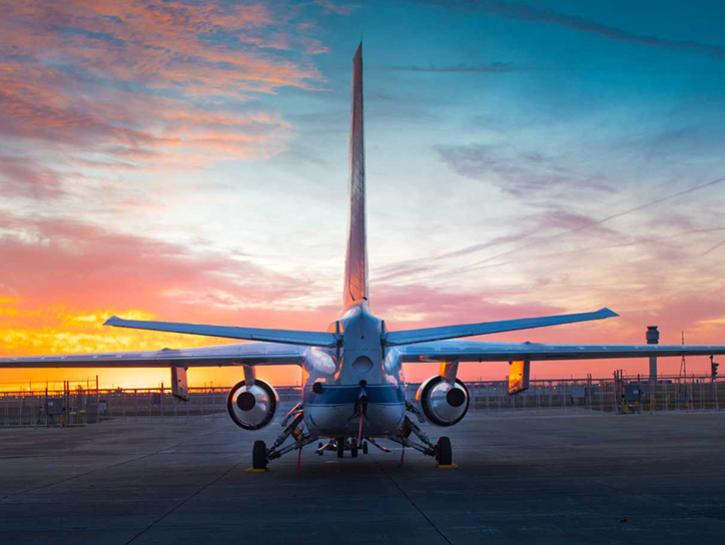 image of airplane and sunset