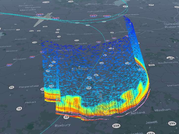 image from FCX showing a road basemap with an aircraft flight path and colored data bands indicating rain and lightning