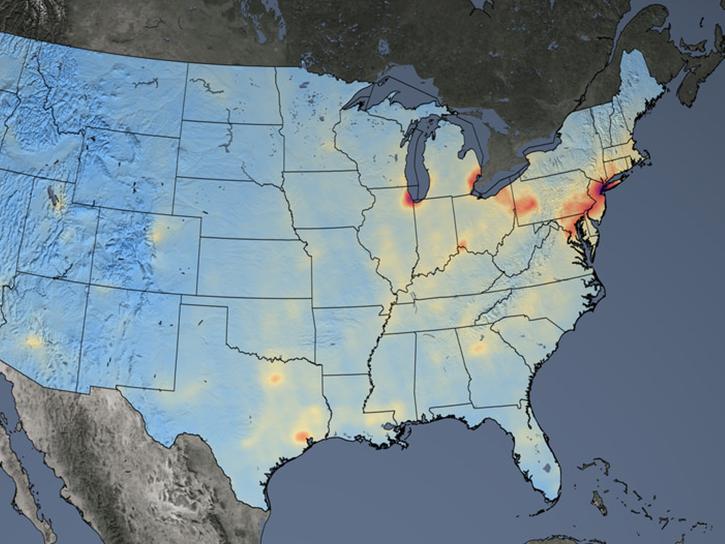 This image shows nitrogen dioxide concentrations across the United States, averaged over 2021. The data were derived from the Aura satellite's Ozone Monitoring Instrument (OMI). Lower levels of gas are colored shades of blue and higher concentrations are depicted in shades from white, red to black. 