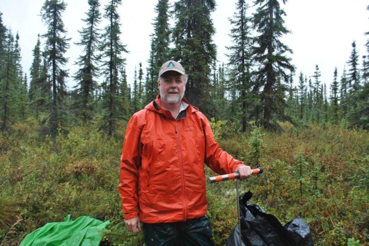Dr. Kevin Schaefer measuring thaw depth in the rain near Fairbanks Alaska, 2017.