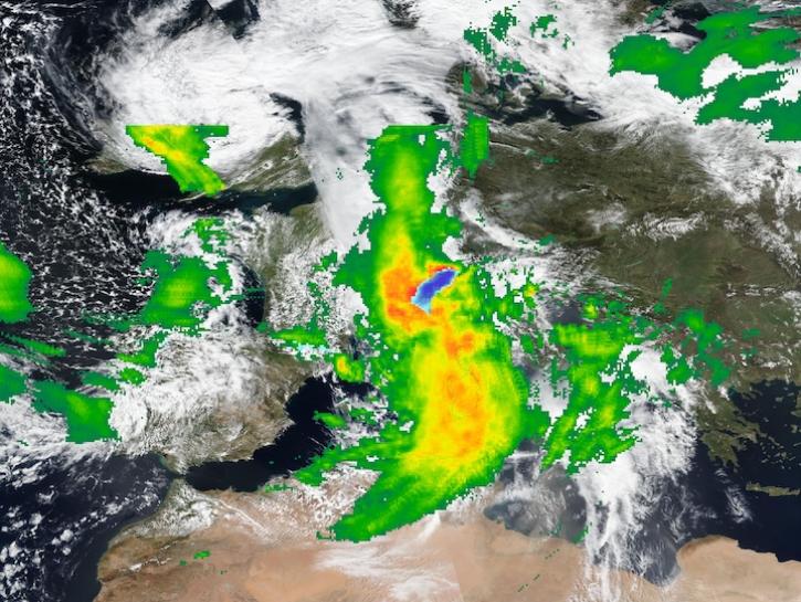 True-color corrected reflectance image from the VIIRS instrument aboard the Suomi NPP satellite overlaid with IMERG Precipitation Rate showing heavy rains and snow over Central Europe