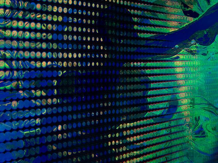 Swirling blues, greens, and yellows evoke imagery of Earth data.