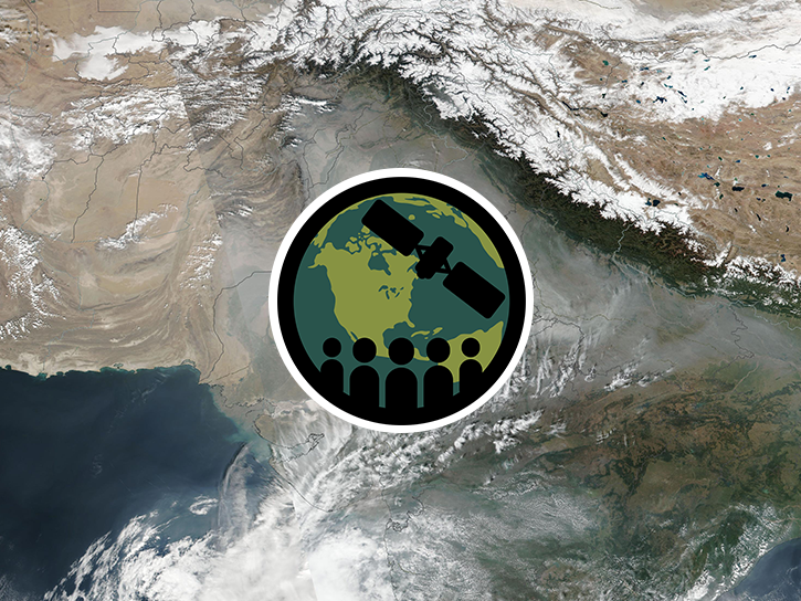 The image is a satellite view of thick haze and air pollution along the southern edge of the Himalayan Mountains in Northern India and Nepal. 