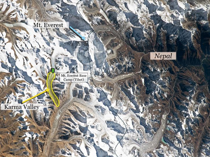 Aerial view of the Mt. Everest area from the International Space Station (ISS). The yellow highlighted region shows the Karma Valley where hikers were rescued from during the snowstorm, with the green marker indicating the approximate location and proximity of the Tibetan Mt. Everest Base Camp