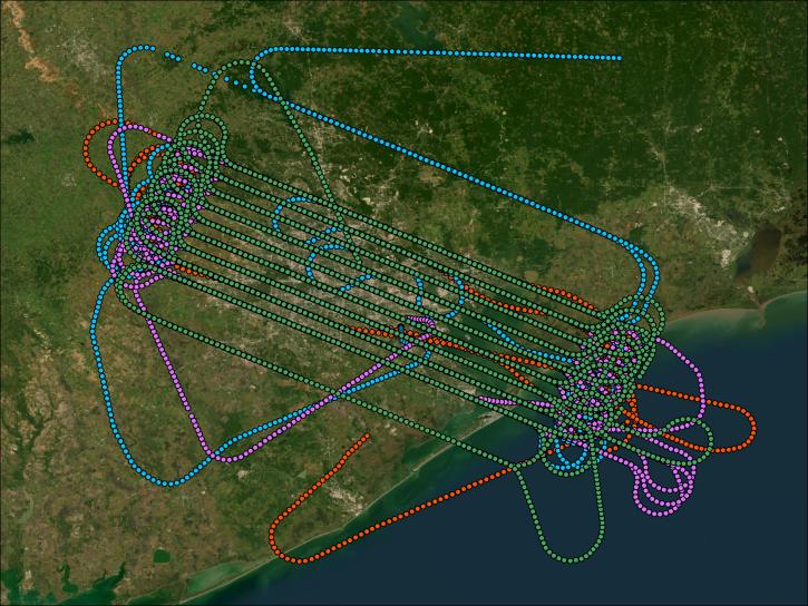 GIS image of TRACER-AQ flight tracks colored, blue, green, purple, and red over satellite imagery of the area.