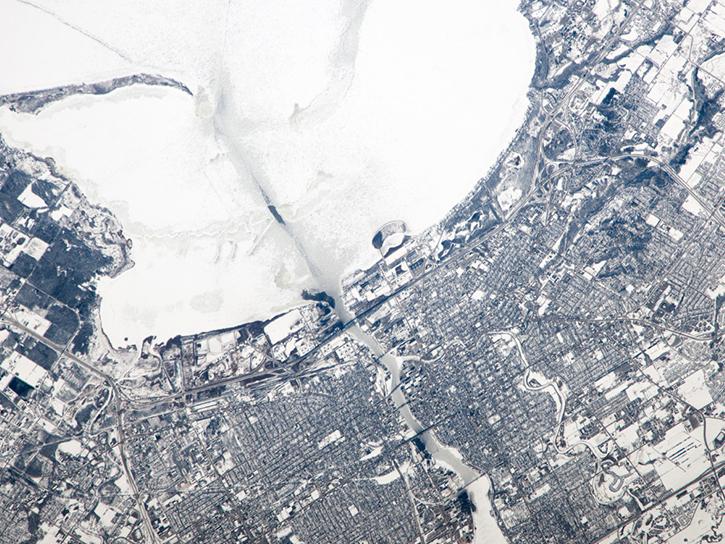 Taken from the International Space Station (ISS), this photograph shows the city of Green Bay, Wisconsin, at the southern end of icebound Green Bay, a basin of Lake Michigan. The heavy snowfalls of winter 2014 cover the landscape. 