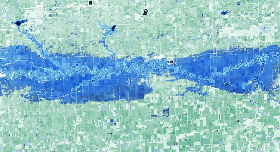 A view of the Red River Valley in Minnesota and North Dakota shows land colored in green and flooded areas in blue.