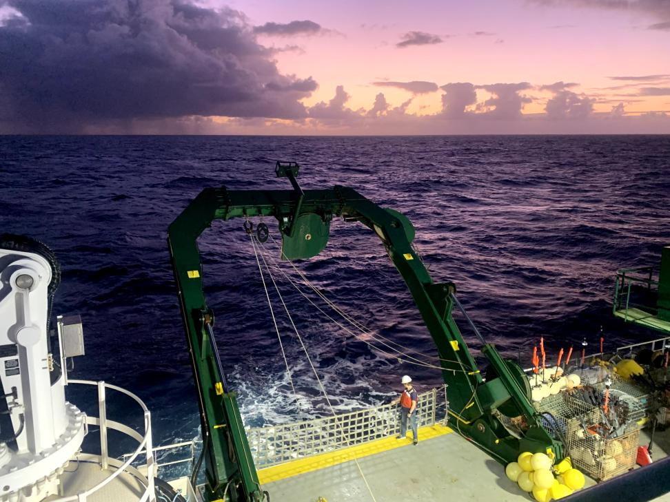 Allen on the stern of the R/V Kilo Moana in August 2021, waiting for the return of an instrument dropped into the sea to collect data.