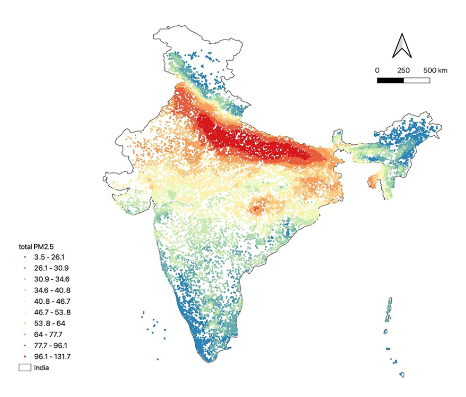 The image shows dots of different colors representing PM2.5 levels across a map of India. Blue and green colors in the lower half of the image indicate lower levels of particulates in the air; yellow and red colors in the upper half indicate areas with high levels of pollutants, such as along the foothills of the Himalayas.