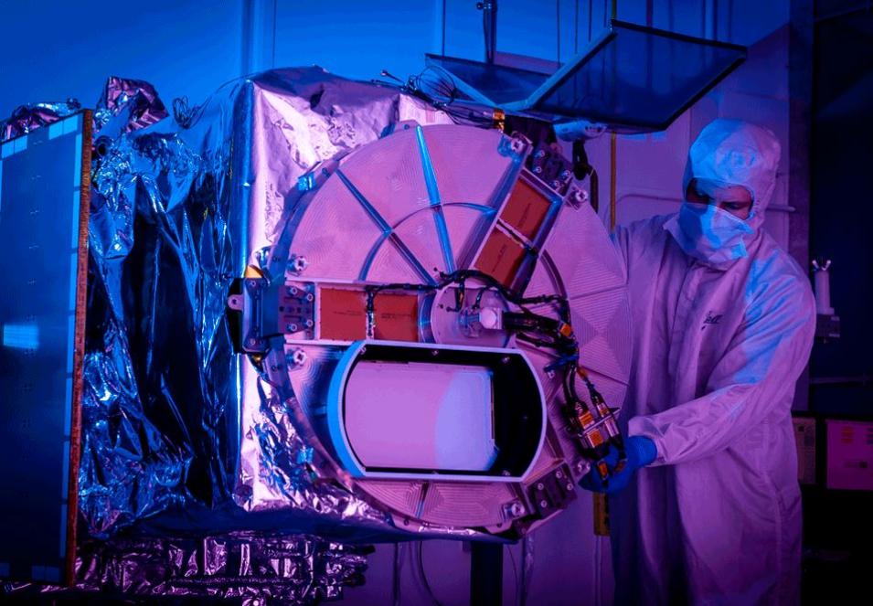 A Ball Aerospace technician inspects the Tropospheric Emissions: Monitoring of Pollution (TEMPO) instrument.