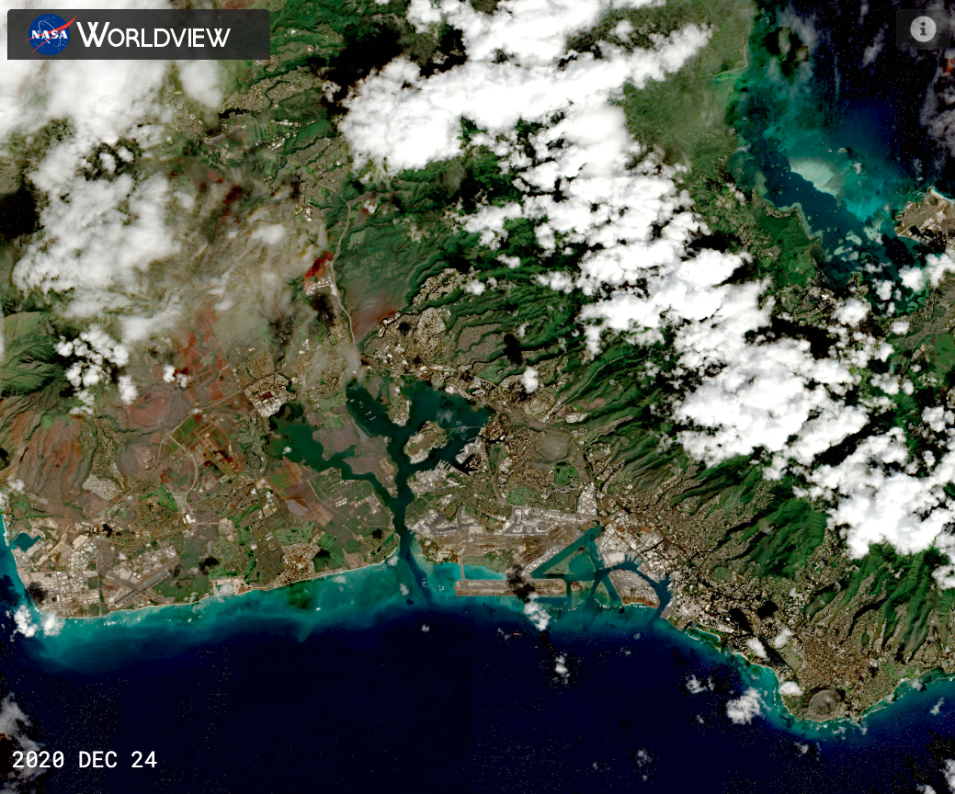 Screenshot of a Worldview satellite image of Oahu, Hawaii, with dark blue ocean surrounding green-brown land beneath a scattering of white clouds.