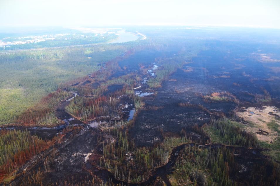 An aerial image showing the burned area following a fire in the South Slave Region of the Northwest Territories.