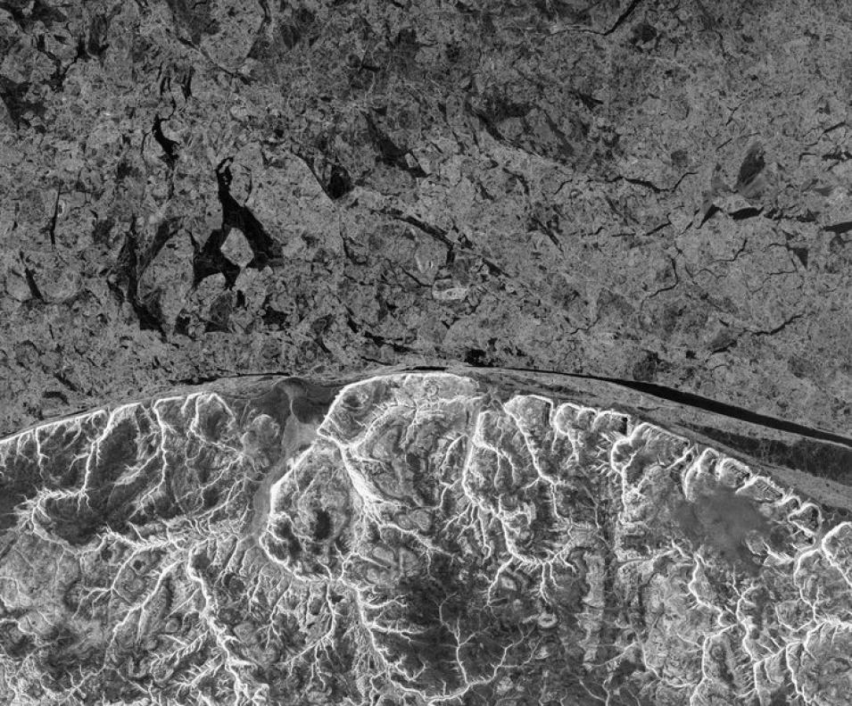 Northwest Passage sea ice contrasts with the coast of Baffin Island, Canada, in this ALOS-PALSAR image taken 8 March 2011.