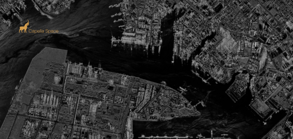Black-and-white SAR image of Jurong Island, Singapore, captured by Capella Space on January 24, 2024, at 23:45 local time using Sliding Spotlight mode. The image showcases detailed Synthetic Aperture Radar (SAR) imagery, with the Capella Space logo in copper displayed in the top-left corner.