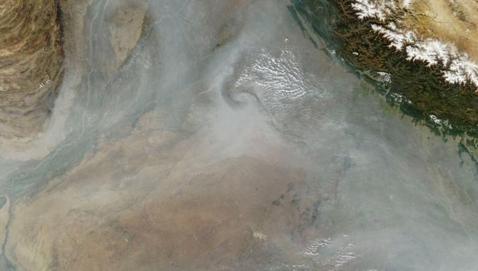 Hazy skies from seasonal crop fires mixing with other aerosol sources blanket arid bright surfaces of the Thar Desert over northern India and eastern Pakistan on November 20, 2023. 