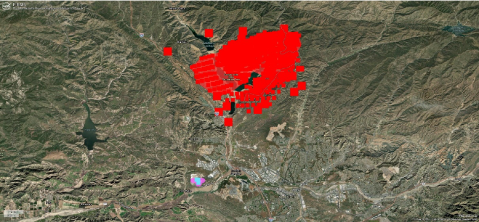 FIRMS imagery shows the Hughes Fire active fire detections occurring during January 22, 2025 (red); Static Thermal Anomalies - Detections from the overnight hours of January 22-23 associated with the landfill to the southwest (cyan); and Static Thermal Anomalies - Mask layer (pink).