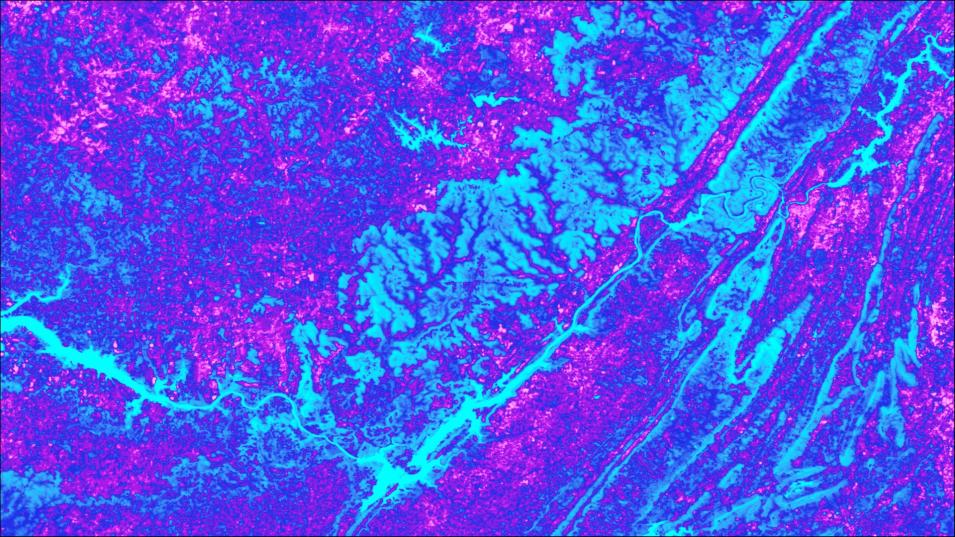 This is a rectangular image of land colored with a mixture of shades of purple and blue to show variantions in surface temperatures across the area. Rivers and other areas appear to be colored light blue.