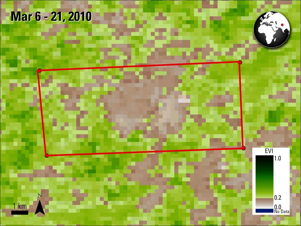 This image is made up of a mixture of green and brown colored pixels. Green pixels represent vegetation and brown pixels are ground area. In the center of the image is the red outline of a large rectangle. In the upper lefthand corner is text reading Mar 6 - 21, 2010. In the upper righthand corner is a circular black and white illustration of the globe with a red dot to plot the location of area studied.