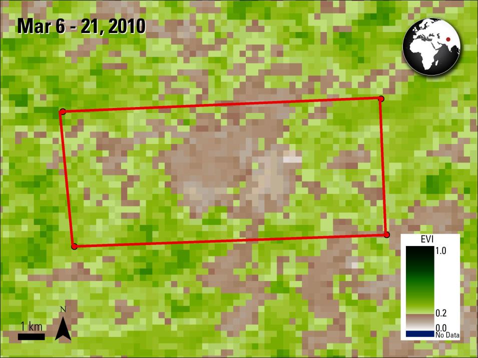 This image is made up of a mixture of green and brown colored pixels. Green pixels represent vegetation and brown pixels are ground area. In the center of the image is the red outline of a large rectangle. In the upper lefthand corner is text reading Mar 6 - 21, 2010. In the upper righthand corner is a circular black and white illustration of the globe with a red dot to plot the location of area studied.