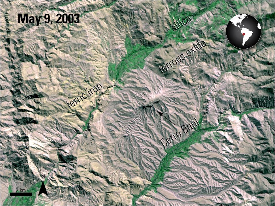 Color infrared ASTER L1B satellite image of Cerro Baúl archaeological site in Peru showing distinct geological features. Different colors represent various mineral compositions including silica, ferric iron, and ferrous oxide that were identified by researchers to map ancient resource procurement networks.