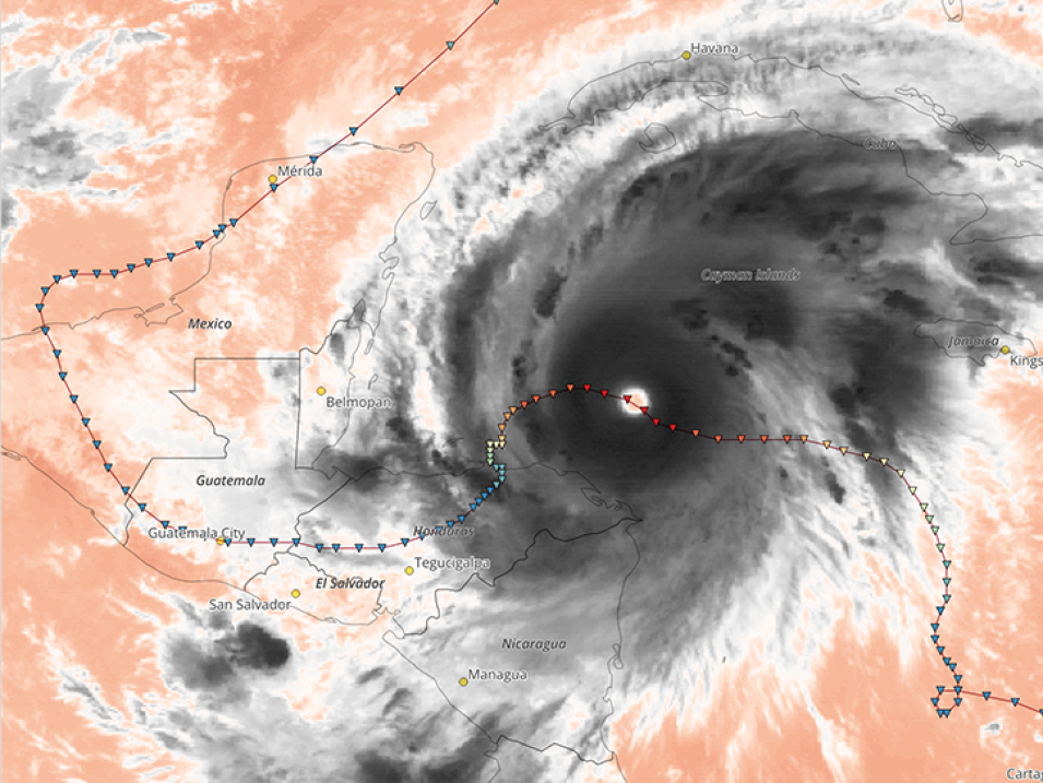 This is an image of infrared brightness temperatures showing Hurricane Mitch on October 26, 1998, at 18:00 UTC. Cloud tops reached frigid temperatures of 196 K, indicating intense convective activity and likely overshooting tops at 16 km altitude. The hurricane’s track is overlaid, with the deepest red symbol marking a central pressure of 905 mb. Mitch remains one of the deadliest Atlantic hurricanes on record, with more than 9,000 lives lost, primarily from flooding in Honduras and Nicaragua.