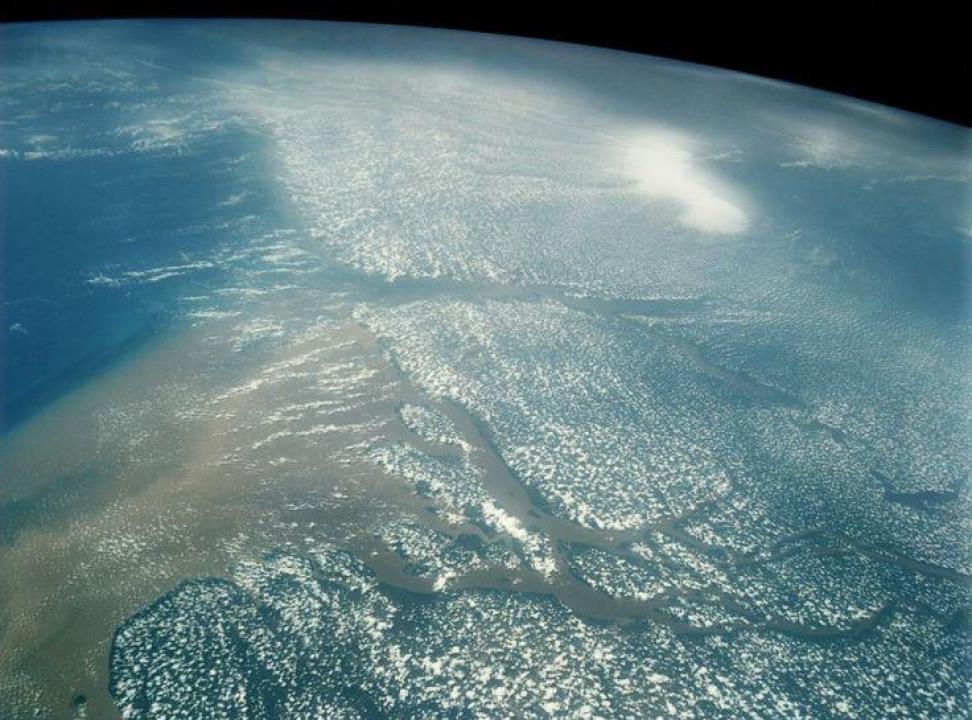 Astronaut photograph of the Amazon River delta and Atlantic Ocean.