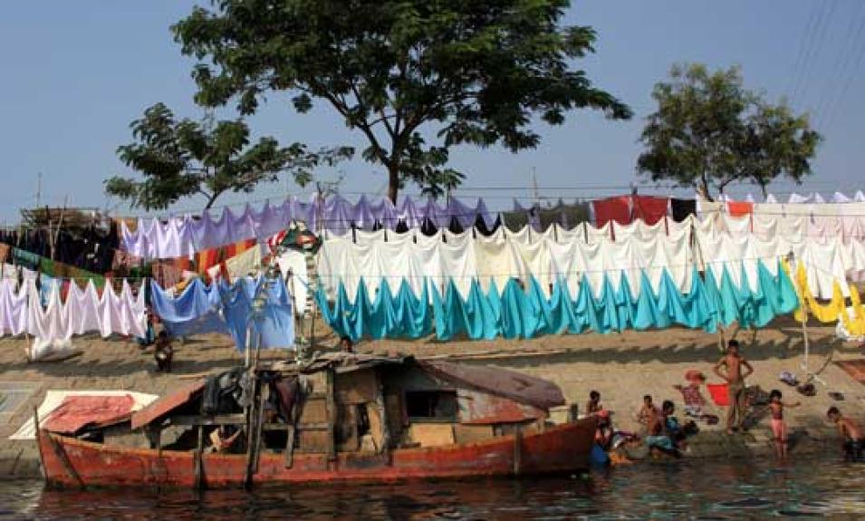 Photograph of people living along a river in Bangladesh