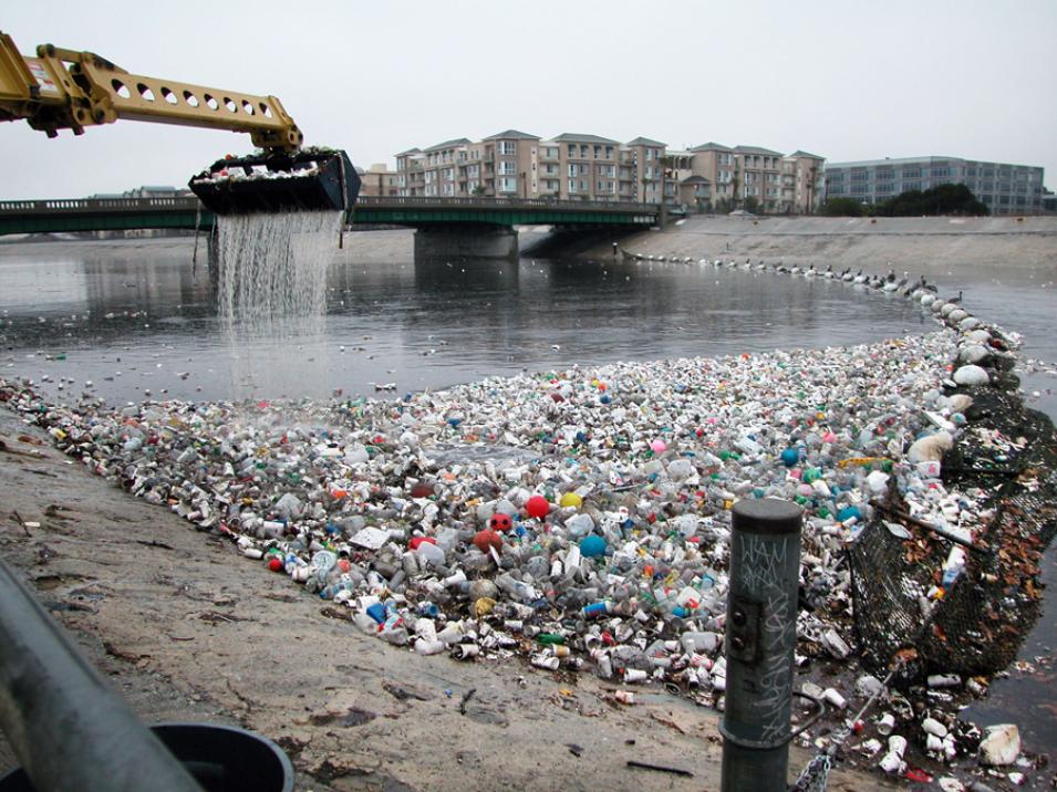 Photograph of machinery moving trash from the Los Angeles River