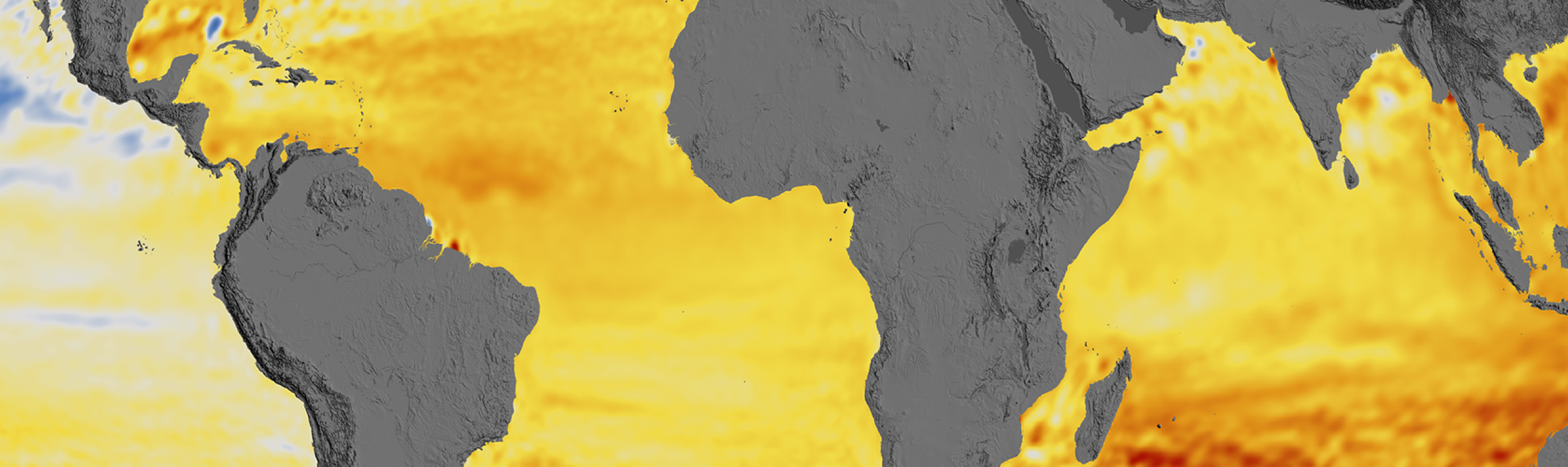 A map of the Earth indicates areas in orange to dark red where sea levels are expected to rise, and gray to blue where they are projected to fall.