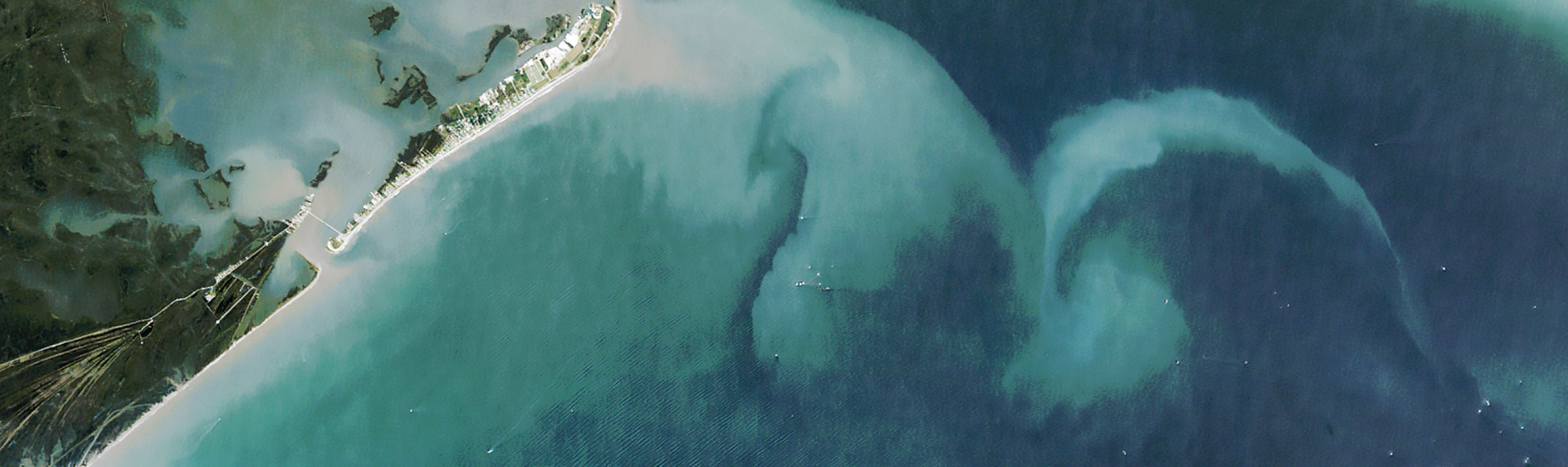 Image of Rupert Bay shows water stained dark brown with tannins and lignins from rivers flowing through boreal forests and wetlands. 