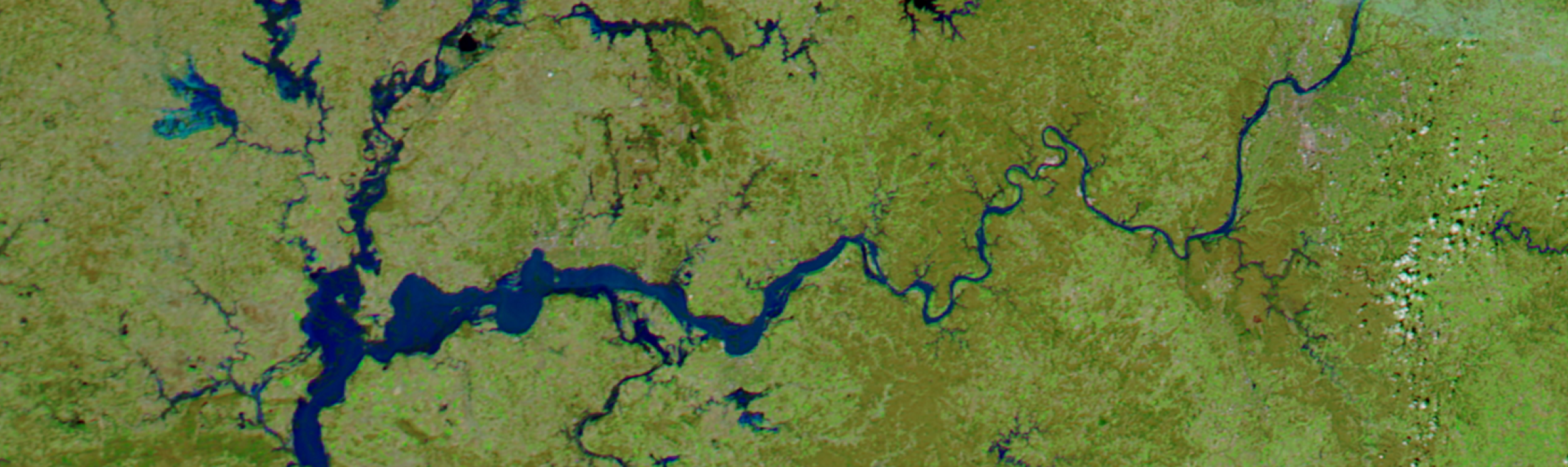 The satellite image appears to show the Ayeyarwady (Irrawaddy) River in Myanmar, known for its high sediment discharge. 