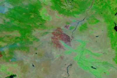 Wildfire burn scars are shown in red on NASA’s false-color corrected reflectance image of the Durkee, Cow Valley, and Badland Complex Fires in Oregon captured on July 23, 2024, from the VIIRS instrument aboard the joint NASA/NOAA NOAA-20 satellite.