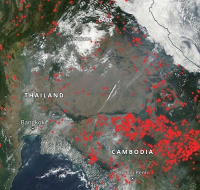 This screen capture from NASA Worldview shows the locations of widespread thermal anomalies and smoke haze in Thailand and neighboring Cambodia.