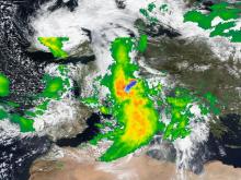 True-color corrected reflectance image from the VIIRS instrument aboard the Suomi NPP satellite overlaid with IMERG Precipitation Rate showing heavy rains and snow over Central Europe