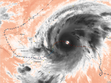 This is an image of infrared brightness temperatures showing Hurricane Mitch on October 26, 1998, at 18:00 UTC. Cloud tops reached frigid temperatures of 196 K, indicating intense convective activity and likely overshooting tops at 16 km altitude. The hurricane’s track is overlaid, with the deepest red symbol marking a central pressure of 905 mb. Mitch remains one of the deadliest Atlantic hurricanes on record, with more than 9,000 lives lost, primarily from flooding in Honduras and Nicaragua.