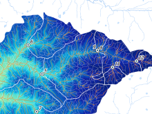 A topographical map of the Goodwin Creek Watershed in Mississippi. Portions of the map are colored in shades of blue to green to show increasing elevation above a water outlet.