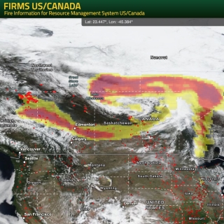 Screenshot of FIRMS US/Canada with active fire/hotspots are ovelain as red dots.